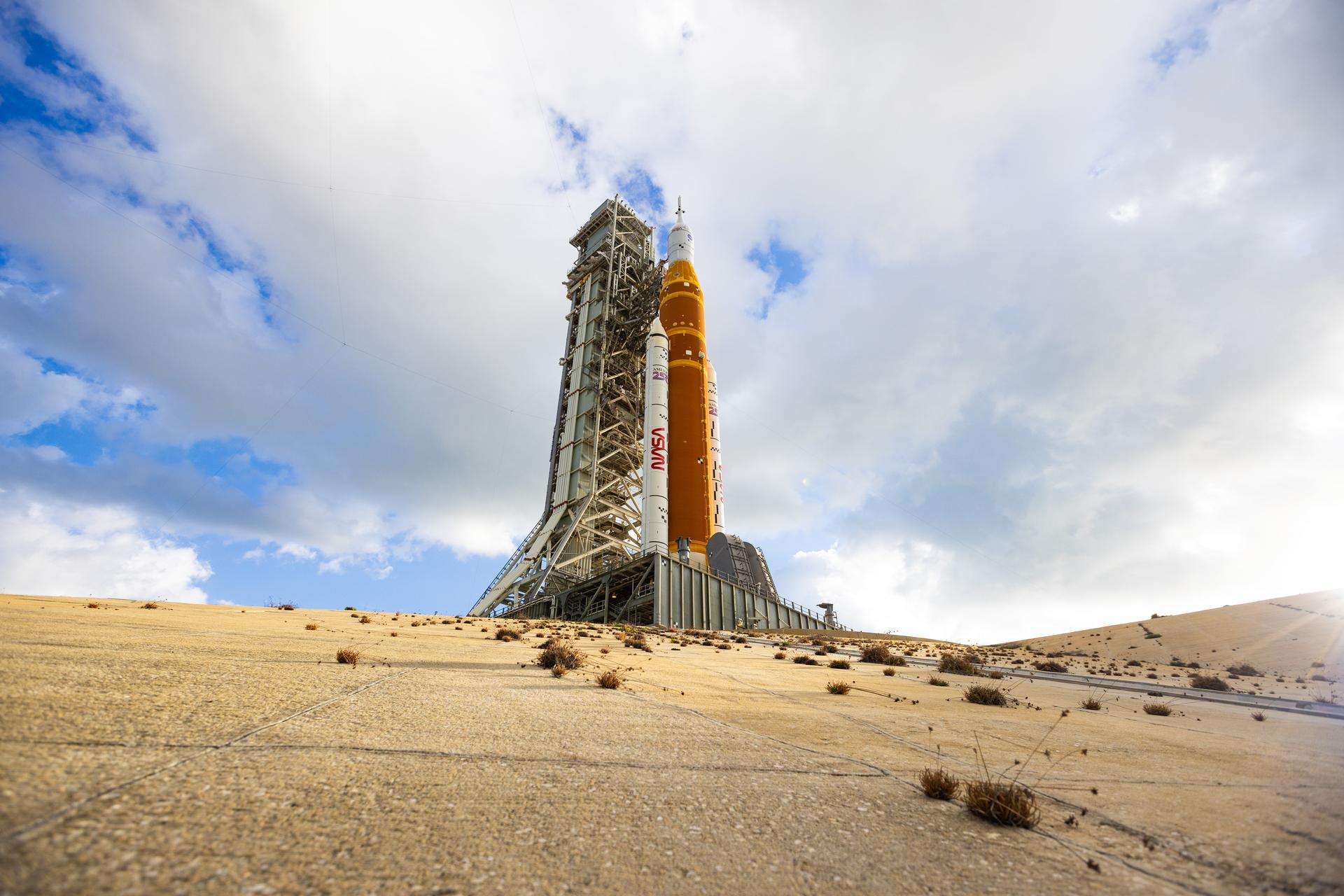 This image shows NASA’s SLS (Space Launch System) and Orion spacecraft rolling out of the Vehicle Assembly Building at NASA’s Kennedy Space Center. NASA's massive Crawler-Transporter, upgraded for the Artemis program, carries the powerful SLS rocket and Orion spacecraft on the Mobile Launcher from the Vehicle Assembly Building to Launch Pad 39B at Kennedy Space Center in preparation for the Artemis II mission.